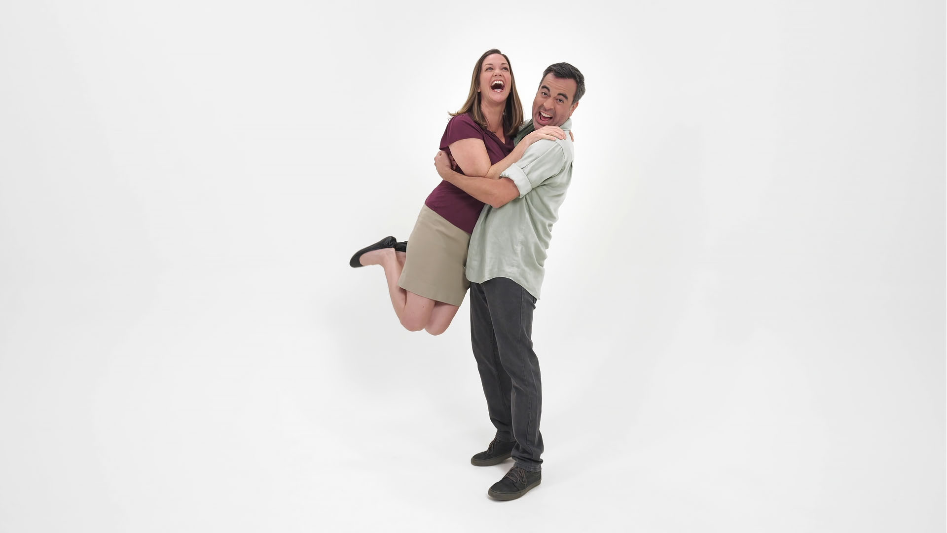 a man holding a woman in his arms